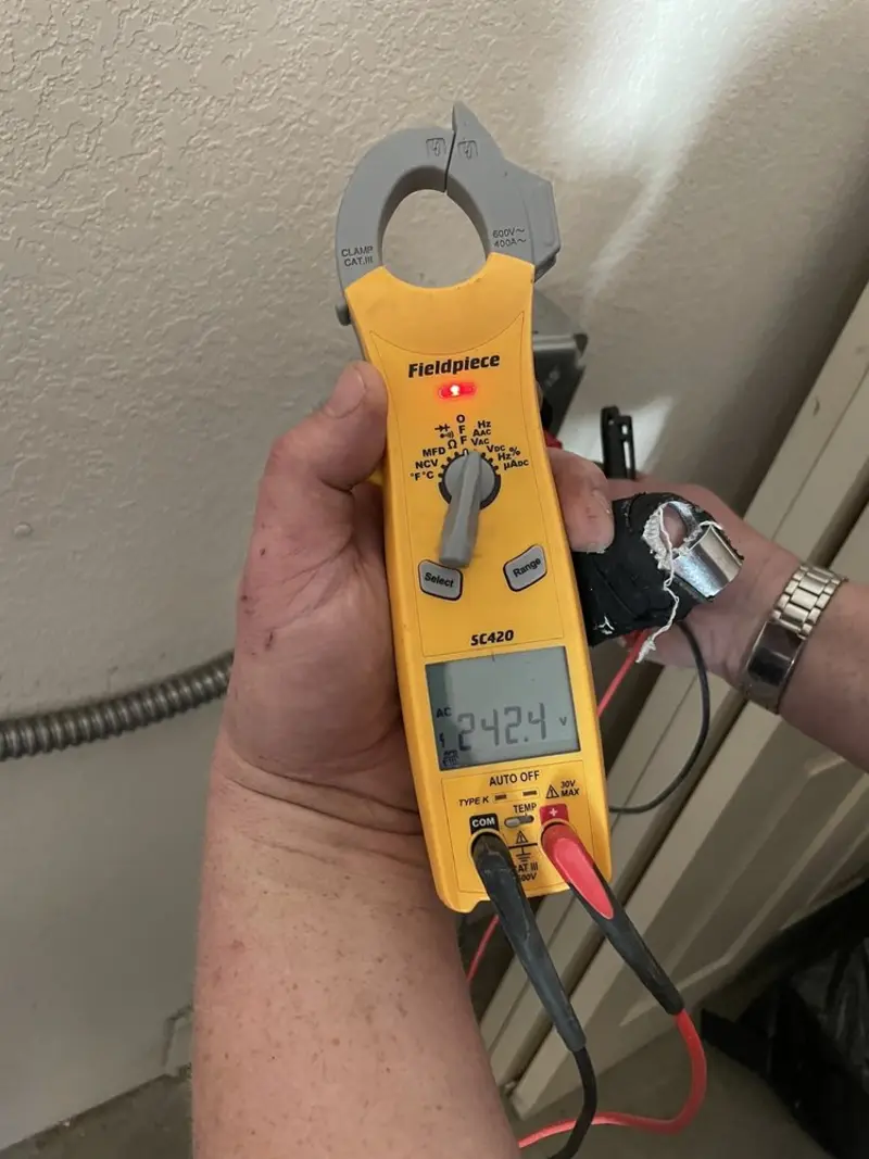 Voltage testing with clamp meter during Whole House Surge Protector in Ossining